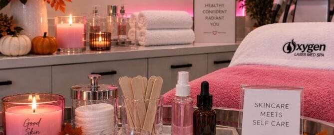 Fall-themed treatment display at Oxygen Med Spa featuring a 'Good Skin Season' candle and 'Skincare Meets Self Care' signage with autumn decor